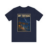 Navy Dry Tortugas National Park Florida shark T-shirt featuring vintage-inspired MOMENT No. 003 artwork with a nighttime fisherman, shark, Fort Jefferson and starry sky.