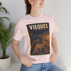 Soft Pink Vieques Island Puerto Rico wild horse T-shirt featuring vintage-inspired MOMENT No. 005 artwork with horses moving through an island town.