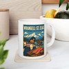 11 oz white ceramic Wrangell-St. Elias Alaska coffee mug featuring MOMENT No. 001 salmon and fish wheel artwork.