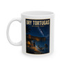Dry Tortugas National Park Florida white ceramic coffee mug featuring vintage-inspired MOMENT No. 003 artwork with a nighttime fisherman, shark, Fort Jefferson and starry sky.
