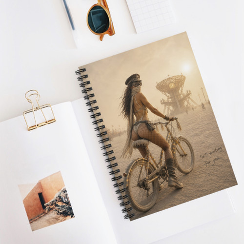 Still Waiting for You desert rider spiral notebook featuring cinematic bicycle artwork, warm dusty tones, and a distant sculptural desert landscape.
