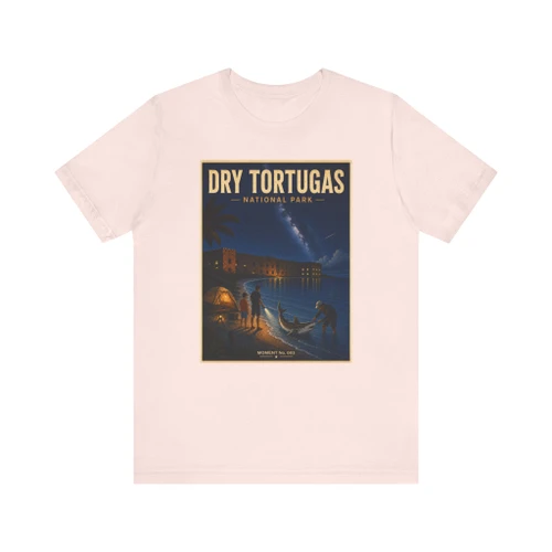 Soft Pink Dry Tortugas National Park Florida shark T-shirt featuring vintage-inspired MOMENT No. 003 artwork with a nighttime fisherman, shark, Fort Jefferson and starry sky.