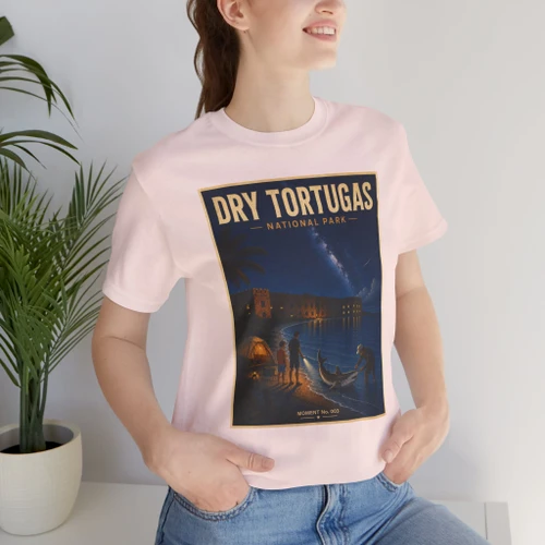 Soft Pink Dry Tortugas National Park Florida shark T-shirt featuring vintage-inspired MOMENT No. 003 artwork with a nighttime fisherman, shark, Fort Jefferson and starry sky.