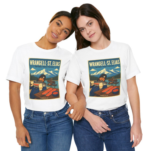 White Wrangell-St. Elias National Park Alaska T-shirt featuring vintage-inspired MOMENT No. 001 artwork with a fisherman, wild salmon and traditional fish wheel.