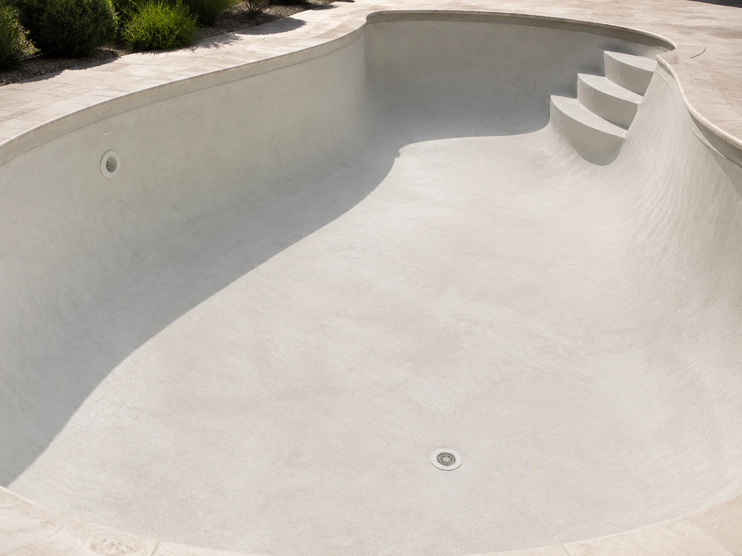 Bare plaster or marcite swimming pool surface