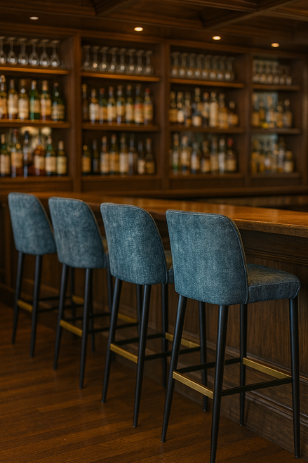 Modern upholstered barstool in slate blue with gold footrest and black metal legs hospitality-grade seating for luxury bars and restaurants