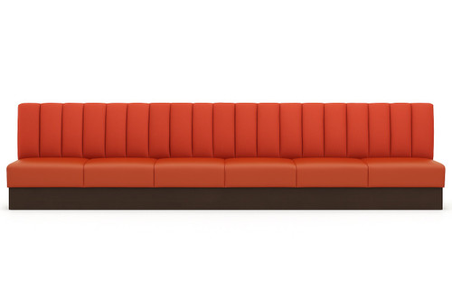 Long red-orange banquette with vertical channel tufting and dark wood plinth base — fully customizable hospitality seating.