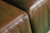 Modern leather sofa in rich cognac brown with clean lines and boxy arms  seams