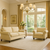 This elegant living room features the Frio Sofa and Armchair set in a matching beige premium upholstery. Designed with classic rolled arms, handcrafted nailhead trim, and dark wood legs, this collection blends timeless craftsmanship with modern comfort. The high-ceiling space is styled with natural sunlight, soft neutral tones, and luxurious décor, creating a sophisticated, inviting atmosphere. Perfect for luxury homes, upscale apartments, and high-end hospitality spaces, the Frio set elevates any interior with its refined aesthetic and customizable finishes.