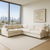 The Sierra L-Shape sectional sofa in performance velvet natural, designed for modern Los Angeles living. Featuring a spacious L-shaped silhouette, deep plush seating, clean lines, and soft off-white upholstery, this luxury sofa brings comfort and elegance to any upscale home, condo, or penthouse. Perfectly styled for high-rise apartments with panoramic views
