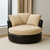 Round cuddle chair with beige suede cushions and black faux-leather base placed in apartment — modern minimalist living room, neutral tones, customizable design by Fashion Forward Furniture.