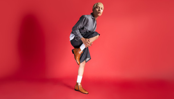 Person wearing custom tan zippered Chelsea boots