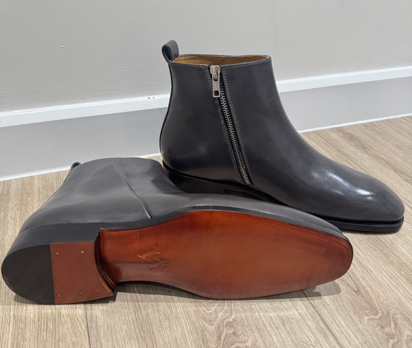 Customer wearing tan leather loafers in a modern interior