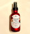 rose mist in red glass bottle with black top