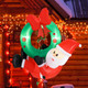 4-Foot Inflatable Santa Claus Wreath with Red Bow & 5 LED Lights product