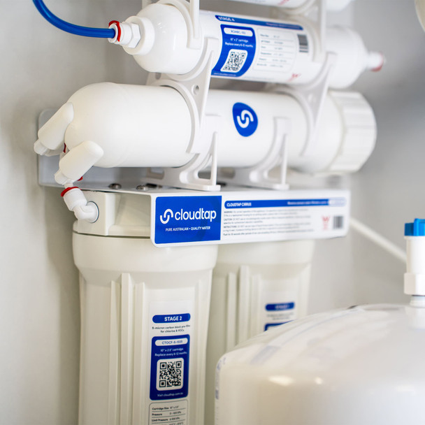 Close-up of a Cirrus 5-stage Reverse Osmosis system with tank installed underneath a kitchen sink