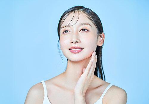 Woman touching her face