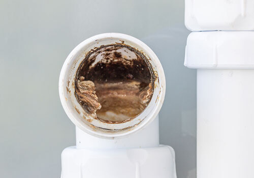 Close-up of limescale inside a pipe