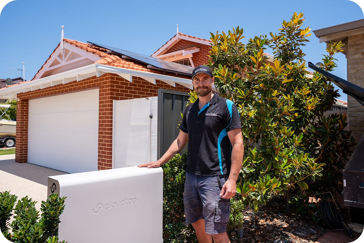 Installer standing next to an installed Design Series unit