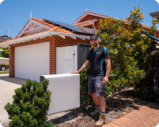 Plumber standing next to an installed Cloudtap Design Series unit