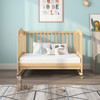 Nursery with a brown wood mini crib and ergoBean Basics Mini3 Single -Stage Breathable Mini Crib Mattress.