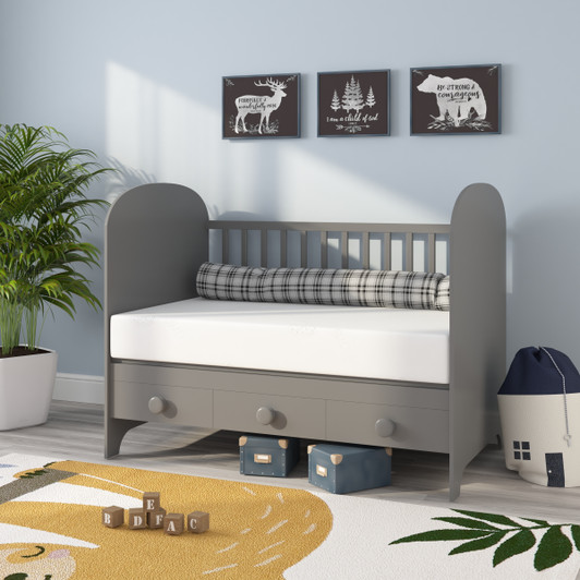 Nursery room scene with gray crib and ergoBean Essentials 6" Dual-Stage Breathable Crib Mattress by Ergo-Pedic.