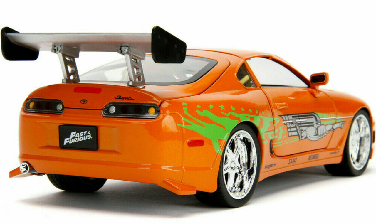 1/18 Jada 1995 Toyota Supra (Orange Metallic) with Lights and Brian Figurine "Fast & Furious" Movie Diecast Model