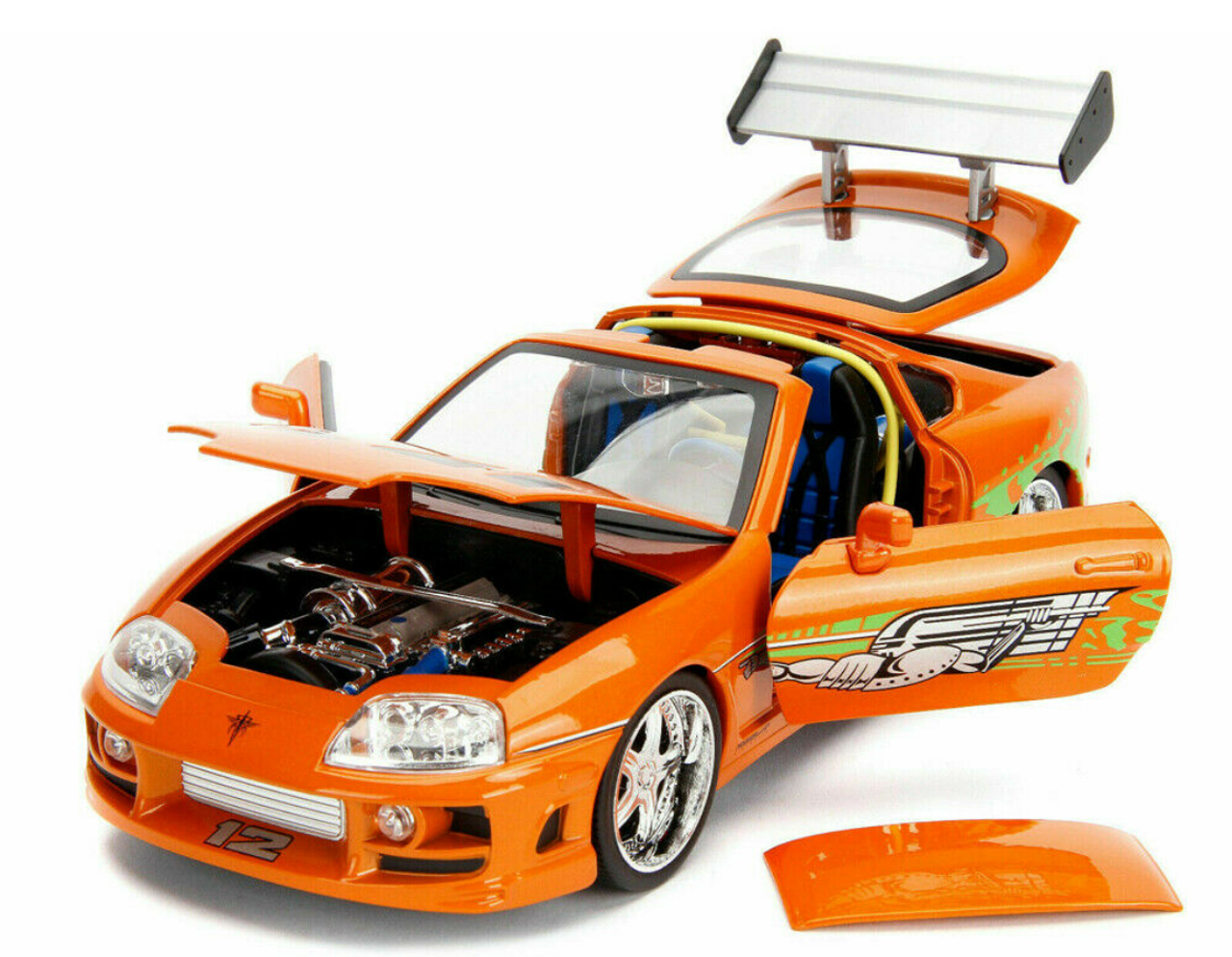 1/18 Jada 1995 Toyota Supra (Orange Metallic) with Lights and Brian Figurine "Fast & Furious" Movie Diecast Model