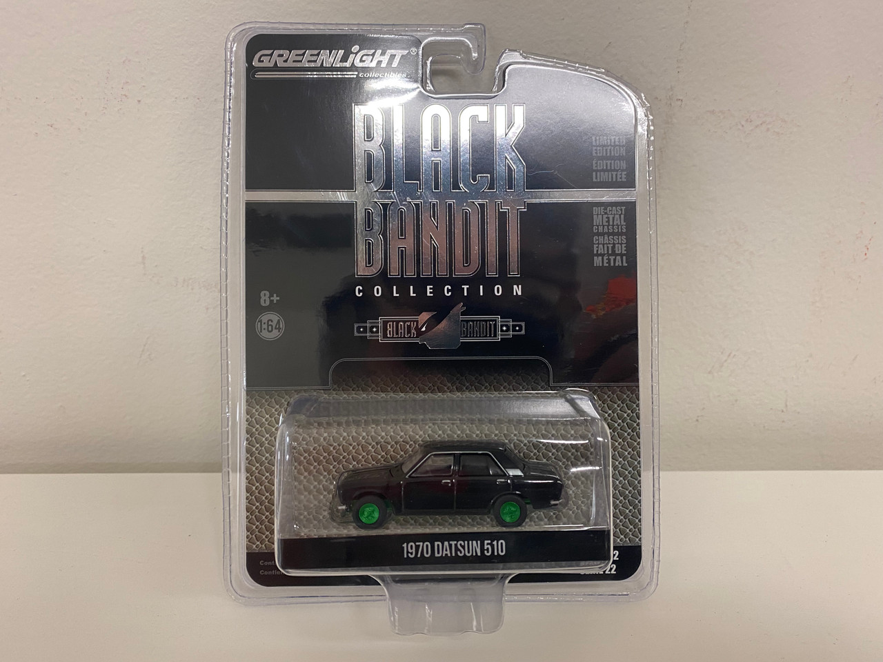 CHASE CAR 1970 Datsun 510 4-Door Sedan "Black Bandit" (Black with Green Wheels) Series 22 1/64 Diecast Model Car by Greenlight