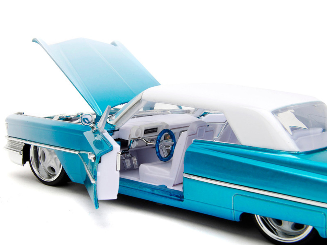 1963 Cadillac Coupe DeVille Blue Metallic and White Gradient with White Top and Interior "Pink Slips" Series 1/24 Diecast Model Car by Jada