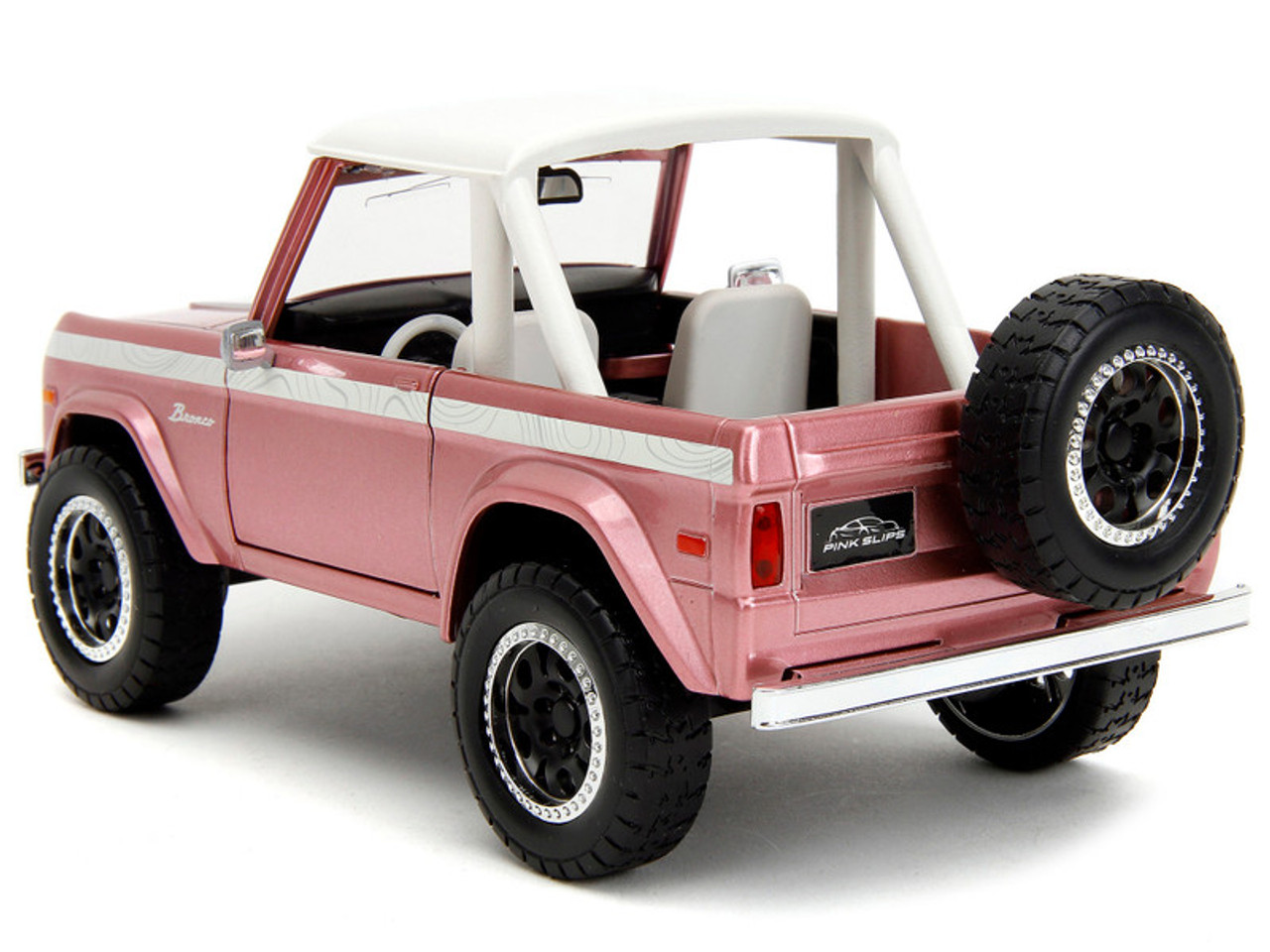 1973 Ford Bronco Pink Metallic with White Top and Graphics "Pink Slips" Series 1/24 Diecast Model Car by Jada