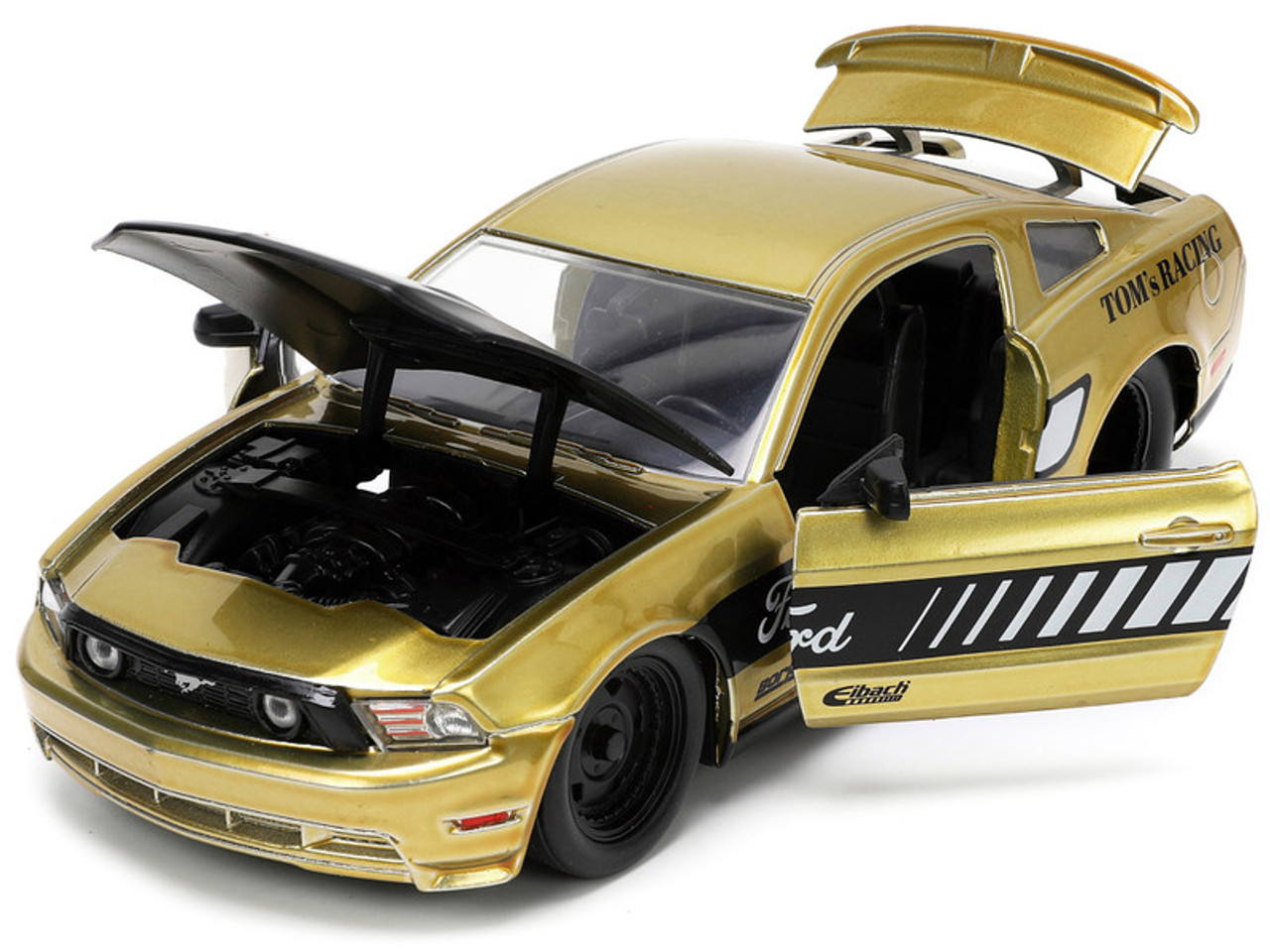 2010 Ford Mustang GT Gold Metallic with Black Graphics and Hood "Tom's Racing" "Bigtime Muscle" Series 1/24 Diecast Model Car by Jada