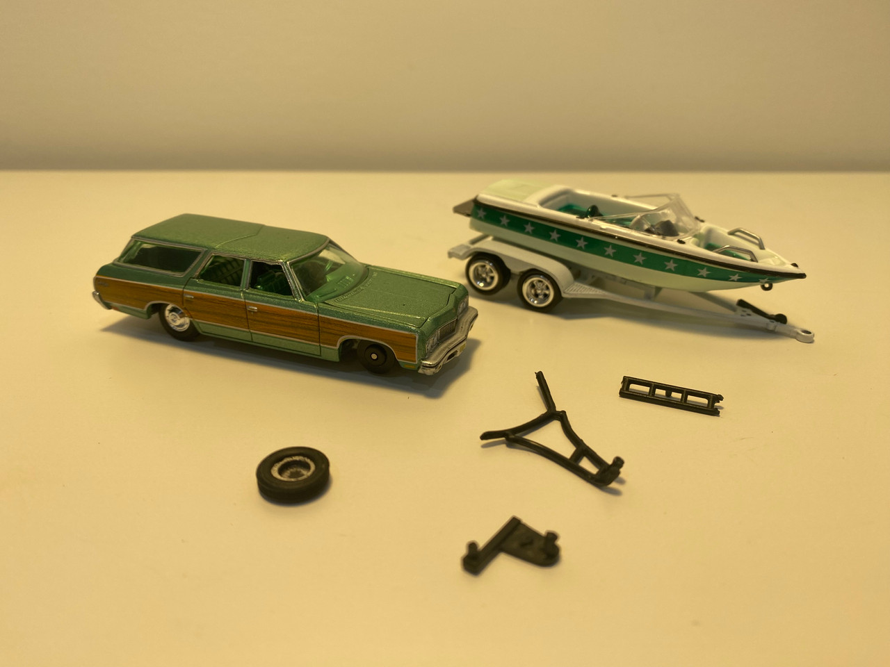 DAMAGED AS-IS 1/64 Johnny Lightning 1973 Chevrolet Caprice Wagon Light Green Metallic with Woodgrain Sides with Mastercraft Boat and Trailer Diecast Car Model