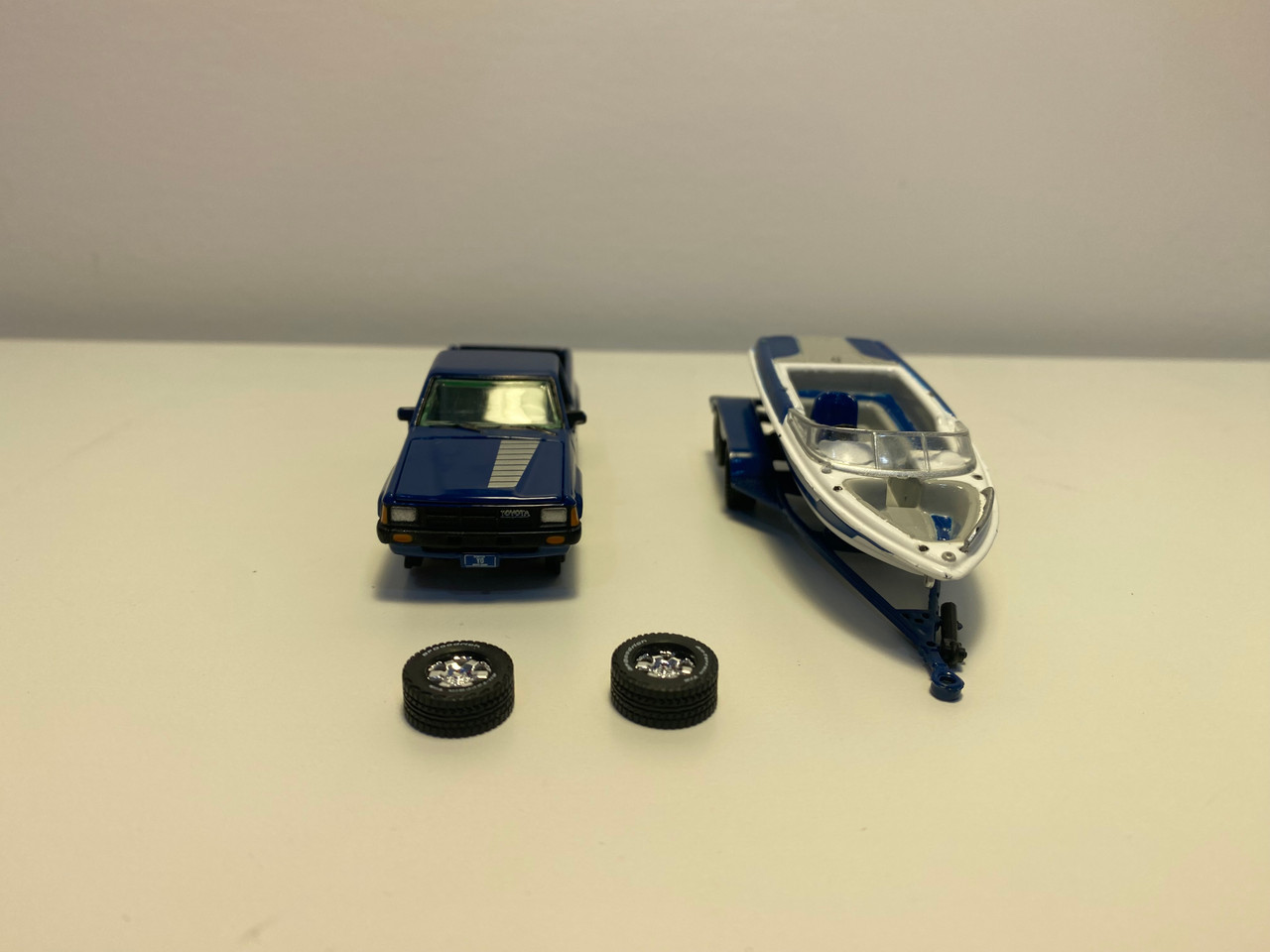 DAMAGED AS-IS 1/64 Johnny Lightning 1985 Toyota SR5 Pickup with Malibu Speed Boat Trailer (Blue) Diecast Models DAMAGED AS-IS 1/64 Johnny Lightning 1985 Toyota SR5 Pickup with Malibu Speed Boat Trailer (Blue) Diecast Models