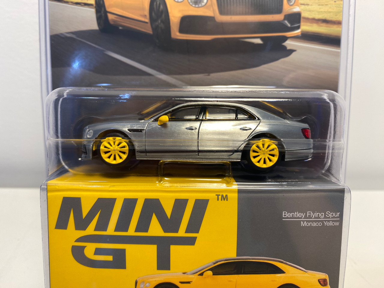 CHASE CAR 1/64 Mini GT Bentley Flying Spur (Chrome Silver with Yellow Wheels) Diecast Car Model