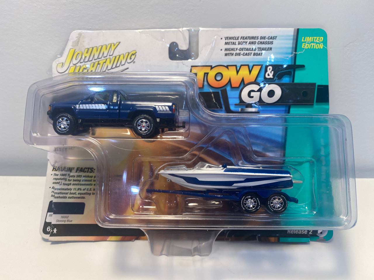 OPEN BOX AS-IS 1/64 Johnny Lightning 1985 Toyota SR5 Pickup with Malibu Speed Boat Trailer (Blue) Diecast Models