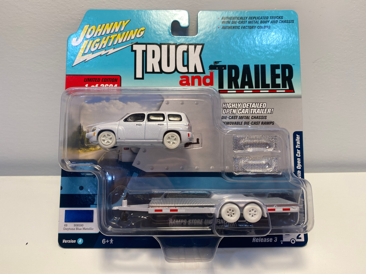 CHASE CAR 2006 Chevrolet HHR Daytona Blue with Chrome Open Car Trailer Limited Edition to 3,604 pieces Worldwide "Truck and Trailer" Series 3 1/64 Diecast Model Car by Johnny Lightning CHASE CAR 2006 Chevrolet HHR Daytona Blue with Chrome Open Car Trailer Limited Edition to 3,604 pieces Worldwide "Truck and Trailer" Series 3 1/64 Diecast Model Car by Johnny Lightning