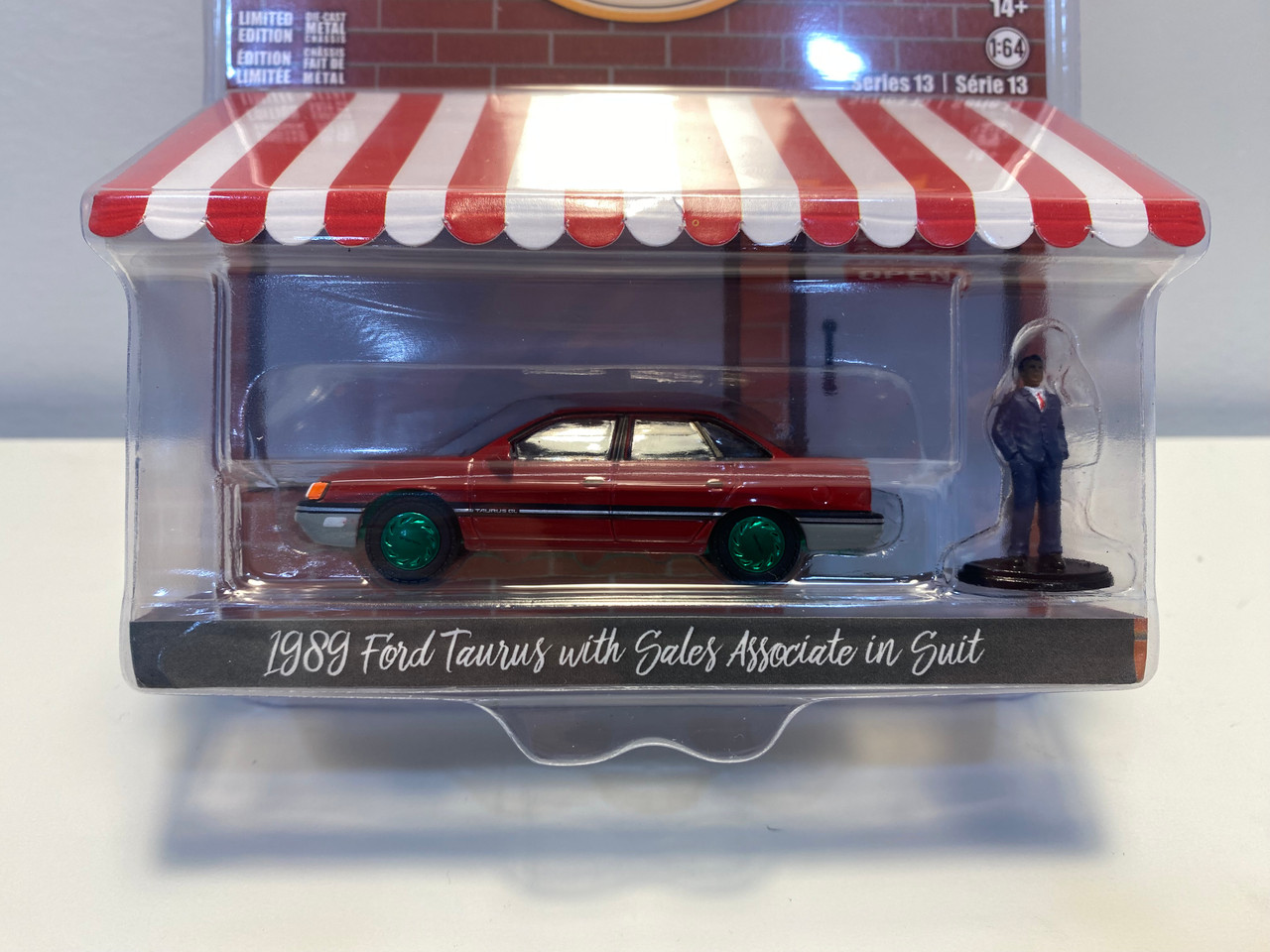 CHASE CAR 1/64 Greenlight 1989 Ford Taurus Red with Black Stripes and Sales Associate in Suit Figure "The Hobby Shop" Series 13 Diecast Car Model