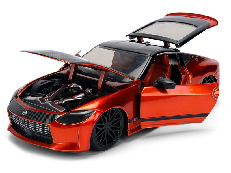 2023 Nissan Z Orange Metallic with Carbon Hood and Black Top "JDM Tuners" Series 1/24 Diecast Model Car by Jada