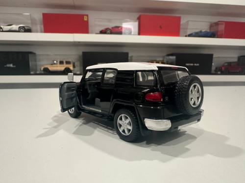 1/36 Kinsmart Kinsmart Toyota FJ Cruiser (Black) 4.6" Diecast Car Model (new no retail box) 1/36 Kinsmart Kinsmart Toyota FJ Cruiser (Black) 4.6" Diecast Car Model (new no retail box)