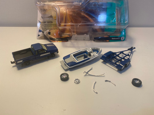 DAMAGED OPEN BOX AS-IS 1/64 Johnny Lightning 1985 Toyota SR5 Pickup with Malibu Speed Boat Trailer (Blue) Diecast Models DAMAGED OPEN BOX AS-IS 1/64 Johnny Lightning 1985 Toyota SR5 Pickup with Malibu Speed Boat Trailer (Blue) Diecast Models