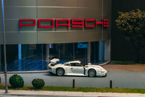 1/64 Tarmac Works Porsche 911 GT1 (White) Diecast Car Model with 1 Pack of 2 Collectible Trading Cards 1/64 Tarmac Works Porsche 911 GT1 (White) Diecast Car Model with 1 Pack of 2 Collectible Trading Cards