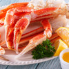 Big, giant Alaska snow crab legs & claws with lemon wedges & melted butter.