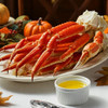 Giant Alaska snow crab legs with hot melted butter served at Thanksgiving.
