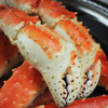 Close-up of two huge king crab legs.
