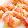 Jumbo shrimp on a stainless steel skewer.