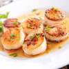 Delicious caramelized Alaska scallops on a plate.