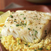 A delicious black cod fillet portion on a bed of couscous.
