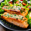 Two delicious roasted Copper River king salmon fillets with festive salad.