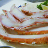 Split Alaska red king crab legs on plate.